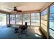 Bright sunroom filled with natural light, ideal for a home office or relaxation space with views of the surrounding landscape at 6924 Tuxedo St, Englewood, FL 34224