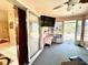 Enclosed sunroom featuring tiled floors and a ceiling fan for a relaxing atmosphere at 6924 Tuxedo St, Englewood, FL 34224