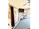Enclosed sunroom featuring tiled floors, a ceiling fan, and sliding glass doors at 6924 Tuxedo St, Englewood, FL 34224
