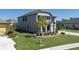 Two-story home features stucco exterior, black shutters, and a well-manicured lawn and front garden at 7406 61St E St, Palmetto, FL 34221