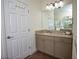 Bright bathroom with a vanity, granite countertop, and neutral paint at 7547 Campus Cv, Sarasota, FL 34243
