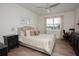 Serene bedroom featuring natural light, a comfortable bed, and a functional desk space at 7547 Campus Cv, Sarasota, FL 34243