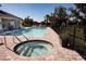 Relaxing community pool and spa area with lounge chairs under a sunny sky at 7547 Campus Cv, Sarasota, FL 34243
