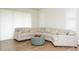 Spacious living room boasts a comfortable sectional sofa and lots of natural light at 7547 Campus Cv, Sarasota, FL 34243