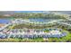 Aerial view of the new neighborhood near a large lake featuring a beautiful community and many modern homes at 818 170Th E Ct, Bradenton, FL 34212