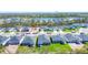 Aerial view of new residential neighborhood with manicured lawns and tree lined streets at 818 170Th E Ct, Bradenton, FL 34212