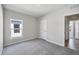 Comfortable bedroom featuring neutral paint, carpet and lots of natural light with a nice sized closet at 818 170Th E Ct, Bradenton, FL 34212
