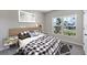Cozy bedroom showcasing a stylish bed, ample natural light, and a calm atmosphere perfect for relaxation at 818 170Th E Ct, Bradenton, FL 34212
