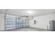 Spacious garage with an automatic door, water heater, and plenty of room for storage at 818 170Th E Ct, Bradenton, FL 34212