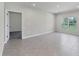 Spacious open living area featuring recessed lighting, tile floors, and an open doorway into another room at 818 170Th E Ct, Bradenton, FL 34212