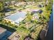 High angle view of the property featuring mature landscaping and canal access at 9031 Hilolo Ln, Venice, FL 34293