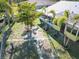 Backyard featuring a brick path and mature landscaping, including mature palm trees at 9031 Hilolo Ln, Venice, FL 34293