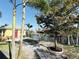 Scenic backyard with mature trees, canal access, and lush landscaping at 9031 Hilolo Ln, Venice, FL 34293