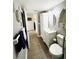 Gray-walled bathroom with toilet, sink, and nautical decor at 9031 Hilolo Ln, Venice, FL 34293