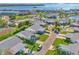 Aerial view of a single Gathering home with a manicured lawn in a coastal community at 9414 Andover Cir, Bradenton, FL 34210