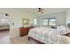 Clean bedroom with light wood floors, light walls, and simple decor at 9414 Andover Cir, Bradenton, FL 34210