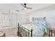 Bedroom featuring a ceiling fan, closet, and natural light at 9414 Andover Cir, Bradenton, FL 34210
