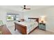 Well-lit bedroom with ceiling fan, and side table at 9414 Andover Cir, Bradenton, FL 34210