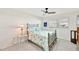 Cozy bedroom with ceiling fan, white walls, and vinyl floors at 9414 Andover Cir, Bradenton, FL 34210