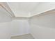 Walk-in closet with white walls and a clothing rack at 9414 Andover Cir, Bradenton, FL 34210