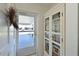 Home entryway featuring a bookshelf and an exterior view at 9414 Andover Cir, Bradenton, FL 34210