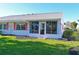 Single Gathering home with pink shutters and a screened in porch at 9414 Andover Cir, Bradenton, FL 34210