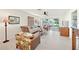 Comfortable living room with sliding doors to the lanai, offering natural light and backyard views at 9414 Andover Cir, Bradenton, FL 34210