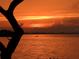 Tranquil waterfront scene at sunset with a kayaker in the distance at 9414 Andover Cir, Bradenton, FL 34210