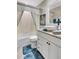Bathroom featuring a sink with a vanity, decorative mirror, and shower at 3807 41St Street W Ct # 52, Bradenton, FL 34205