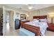 Bedroom with a dresser, mirror, nautical decor, and an open doorway at 3807 41St Street W Ct # 52, Bradenton, FL 34205