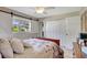 Bedroom with a view, decorative bedding and a double door closet at 3807 41St Street W Ct # 52, Bradenton, FL 34205