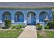Charming porch with arched entryways, comfortable seating, and beautifully manicured landscaping, creating a warm, inviting atmosphere at 3807 41St Street W Ct # 52, Bradenton, FL 34205
