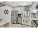 Modern kitchen features stainless steel appliances, sleek white cabinets, and a stylish countertop at 3807 41St Street W Ct # 52, Bradenton, FL 34205