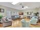 Spacious living room with hardwood floors and ceiling fan at 3807 41St Street W Ct # 52, Bradenton, FL 34205