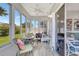 Enclosed sunroom with tile floor and ceiling fan at 3807 41St Street W Ct # 52, Bradenton, FL 34205