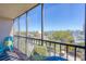 Relaxing balcony with comfortable seating offering serene views at 1001 Benjamin Franklin Dr # 511, Sarasota, FL 34236