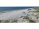 Picturesque beach featuring lounge chairs and umbrellas on the sandy shore at 1001 Benjamin Franklin Dr # 511, Sarasota, FL 34236