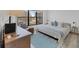 Comfortable bedroom with large window and stylish decor at 1001 Benjamin Franklin Dr # 511, Sarasota, FL 34236