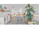 Inviting dining area with modern decor, natural light, and a large indoor plant at 1001 Benjamin Franklin Dr # 511, Sarasota, FL 34236