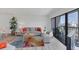 Open-concept living area with access to a balcony, offering a bright and airy space at 1001 Benjamin Franklin Dr # 511, Sarasota, FL 34236