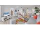 Bright living space, with white walls, flows into the dining area, creating an open and airy atmosphere at 1001 Benjamin Franklin Dr # 511, Sarasota, FL 34236