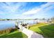 Inviting backyard featuring boat dock and a brick pathway at 1022 Overlook Ct, Bradenton, FL 34208