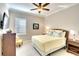 Cozy bedroom with ceiling fan, natural light, and decorative accents at 1022 Overlook Ct, Bradenton, FL 34208