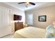 Bedroom featuring ample natural light, stylish decor, and ceiling fan at 1022 Overlook Ct, Bradenton, FL 34208