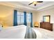 Bedroom featuring ample natural light, stylish decor, and neutral walls at 1022 Overlook Ct, Bradenton, FL 34208