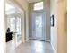 Bright entryway with tile floors, a decorative glass front door, and adjacent office space at 1022 Overlook Ct, Bradenton, FL 34208