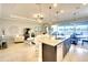 Open kitchen offering stainless appliances, a breakfast bar, and views into the bright living space at 1022 Overlook Ct, Bradenton, FL 34208