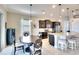 Open kitchen with granite counters, stainless appliances and eat-in dining area with pendant lighting at 1022 Overlook Ct, Bradenton, FL 34208