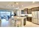 Modern kitchen with stainless steel appliances, a center island, and convenient seating at 1022 Overlook Ct, Bradenton, FL 34208