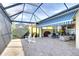 Large lanai with screened enclosure, comfortable seating, and waterfront view, perfect for entertaining at 1022 Overlook Ct, Bradenton, FL 34208
